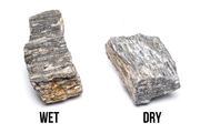 Ancient petrified stone from UNSHARDSCAPE showing textured, weathered surface with natural mineral patterns and earthy tones.
