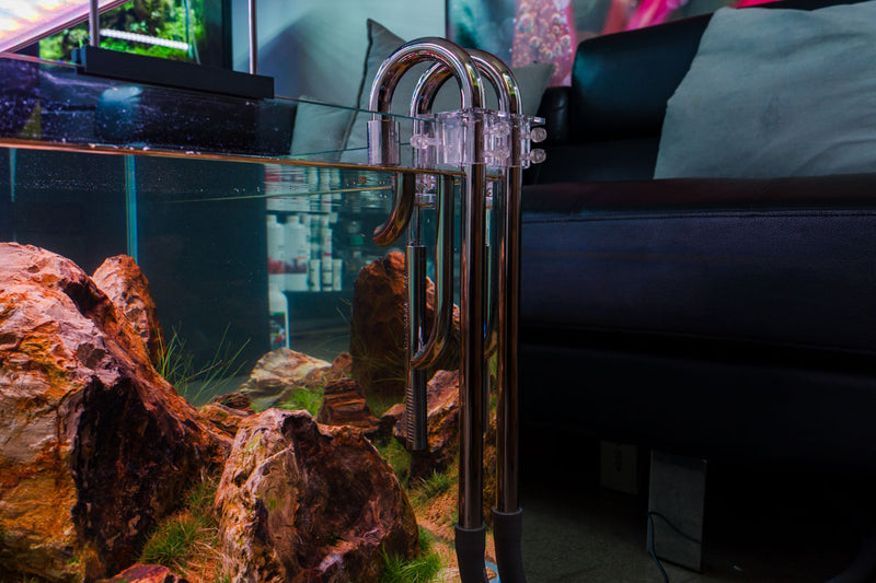 Stainless steel Lily pipes with skimmer for aquarium filtration by Aqua Worx Flux, designed for efficient water flow and cleaning.