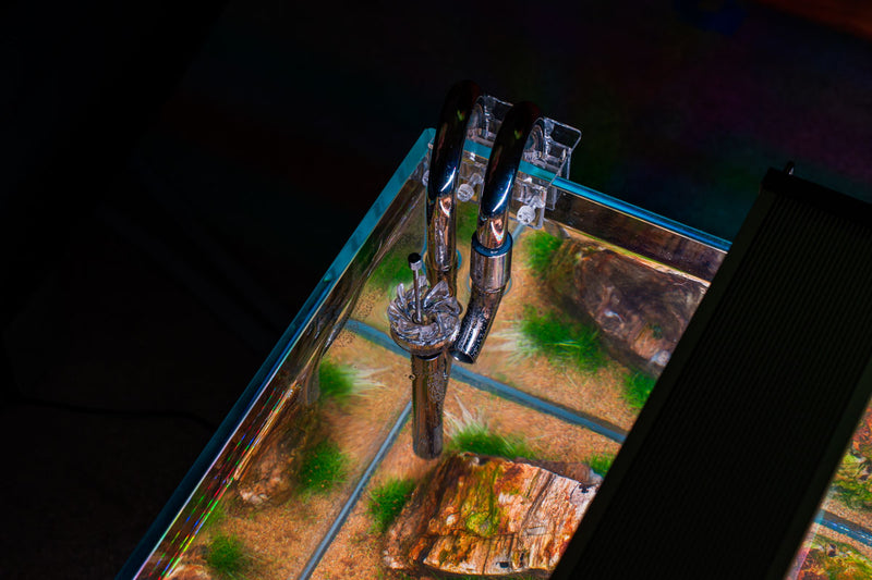 Aqua Worx Flux stainless steel lily pipes with skimmer for aquarium filters, featuring sleek design and functional filtration components.
