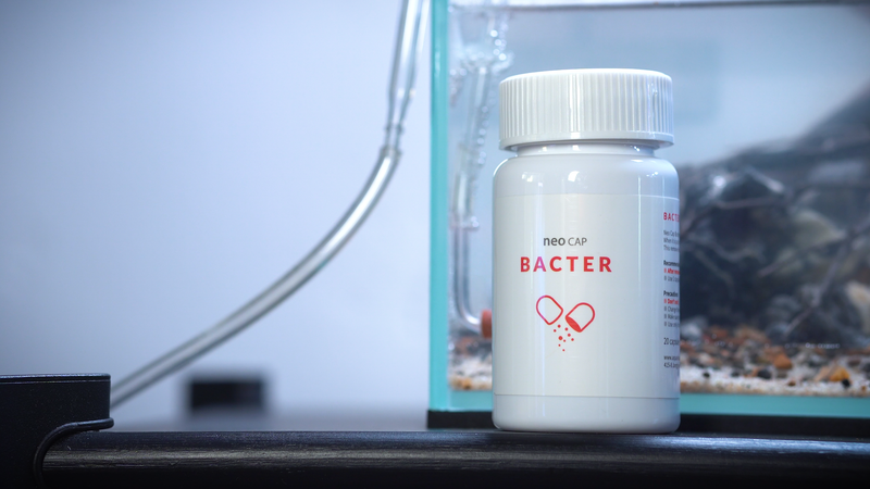 Aquario Neo Cap water conditioner cap in clear plastic with branding, designed for aquarium use.