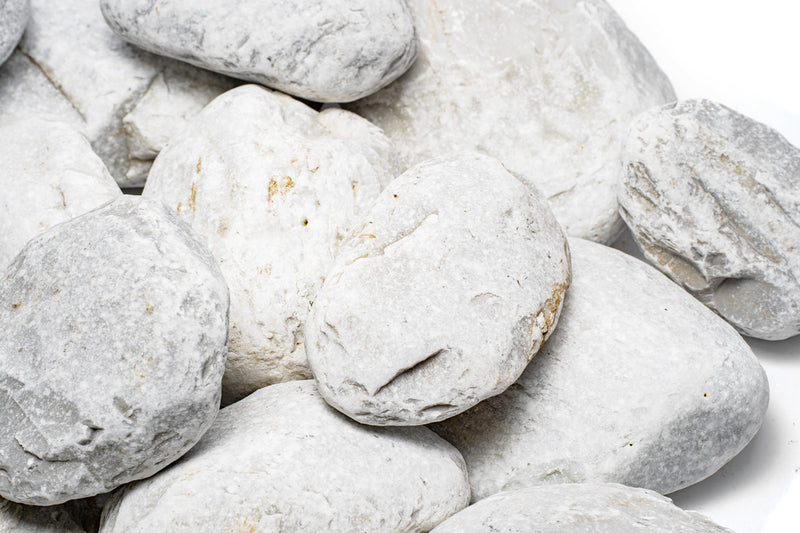 Unshardscape Ashen Stone, a gray textured stone with a rough surface, used for decorative or construction purposes.