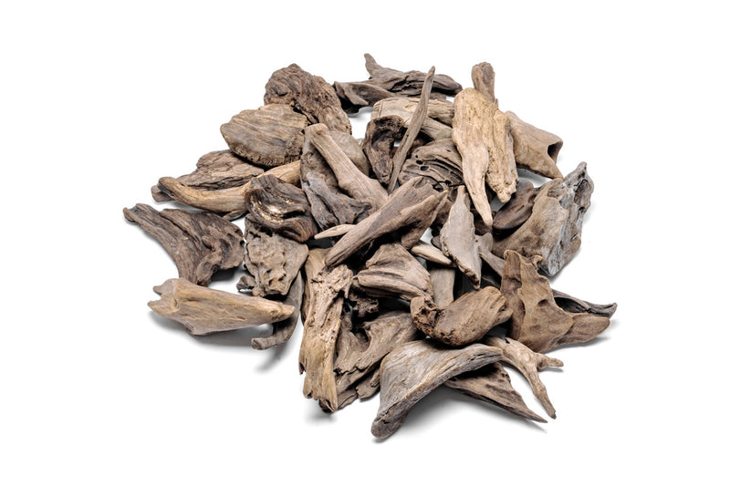 Assorted driftwood accent wood pieces arranged naturally, showcasing varied shapes and textures for decorative use.
