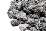 Black Lava Rock stone from UNSHARDSCAPE, showing textured volcanic rock with porous surface ideal for landscaping or gardening.