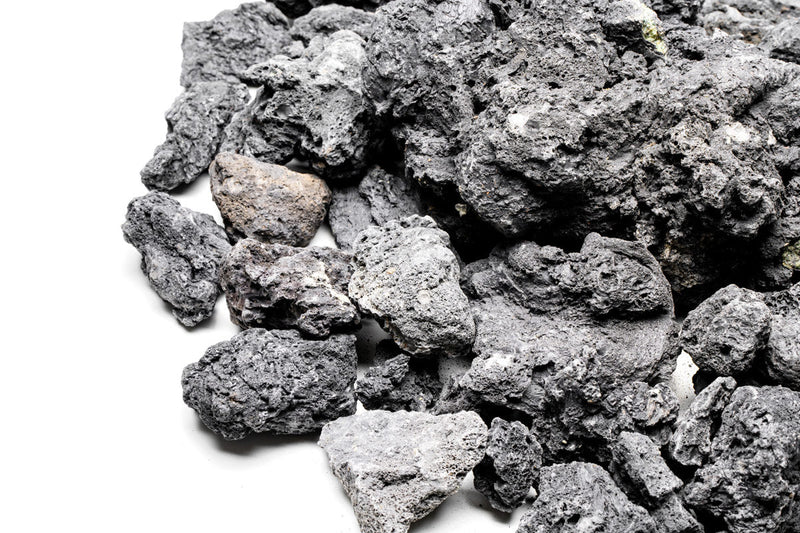 Black Lava Rock stone from UNSHARDSCAPE, showing textured volcanic rock with porous surface ideal for landscaping or gardening.