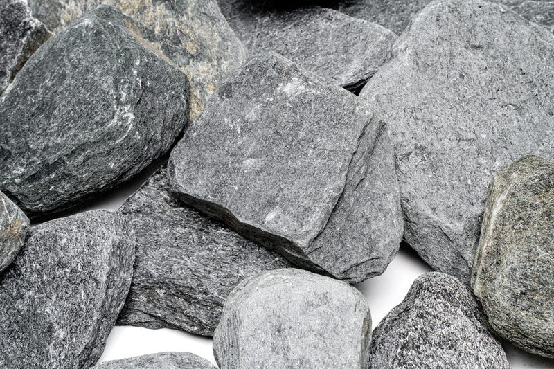 Black River Slate hardscape by UNSHARDSCAPE, showcasing textured, dark stone slabs suitable for outdoor landscaping projects.