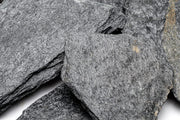 Black slate hardscape tile from UNSHARDSCAPE with a smooth, matte surface, ideal for outdoor landscaping and patio design.