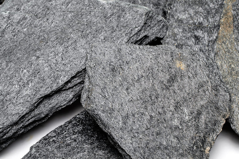 Black slate hardscape tile from UNSHARDSCAPE with a smooth, matte surface, ideal for outdoor landscaping and patio design.