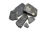 Black slate hardscape stone from UNSHARDSCAPE with a smooth, natural finish, ideal for outdoor landscaping and pathways.