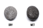 Black UNSHARDSCAPE Star Lava Rock stone featuring a dark, porous surface ideal for decorative or gardening use.