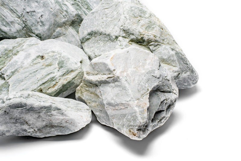 Gray Caledonia stone from UNSHARDSCAPE, showing a textured natural stone surface ideal for landscaping or decorative projects.