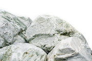 Natural Caledonia Stone from UNSHARDSCAPE showing its textured, earthy surface with shades of brown and gray.