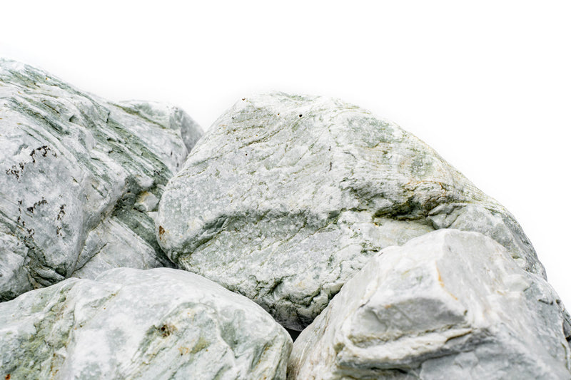Natural Caledonia Stone from UNSHARDSCAPE showing its textured, earthy surface with shades of brown and gray.