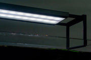 Chihiros WRGB II SLIM Edition LED aquarium light with adjustable spectrum and slim design, mounted over a fish tank.