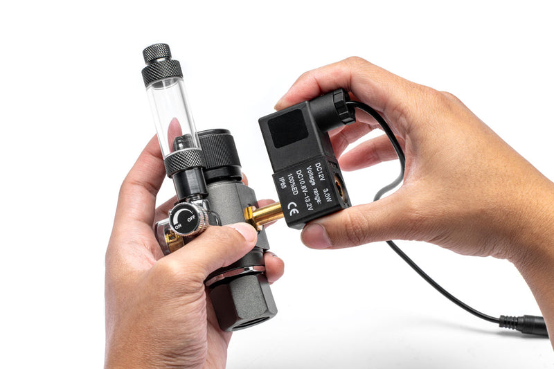 UNSCO2 CO2 regulator solenoid replacement accessory with brass fittings and control components for precise gas regulation.