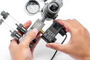 UNSCO2 CO2 regulator solenoid replacement accessory, showing the compact brass valve and electrical connection for gas control.