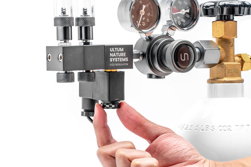 UNSCO2 CO2 regulator solenoid replacement accessory with electrical connections and mounting components.