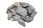 Dark blue slate stone from UNSHARDSCAPE, showing smooth, natural textured surface suitable for landscaping or decorative projects.