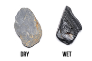 Dark blue slate stone from UNSHARDSCAPE, showing a textured surface with natural variations and smooth edges.