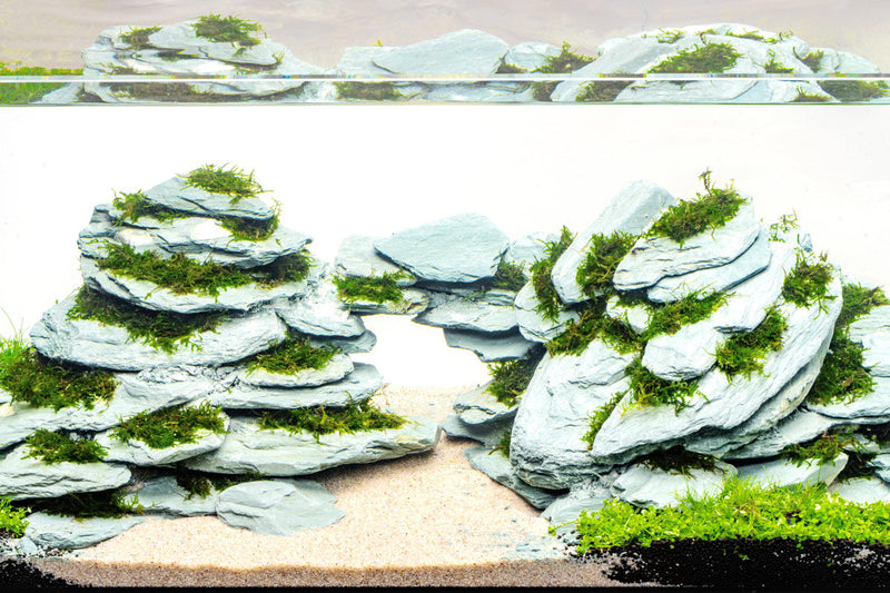 Grey River Slate hardscape by UNSHARDSCAPE, showing textured grey slate stones suitable for outdoor landscaping and pathways.