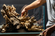 Natural driftwood piece called Madra Wood by UNSHARDSCAPE, showcasing its textured, weathered wood surface and organic shape.