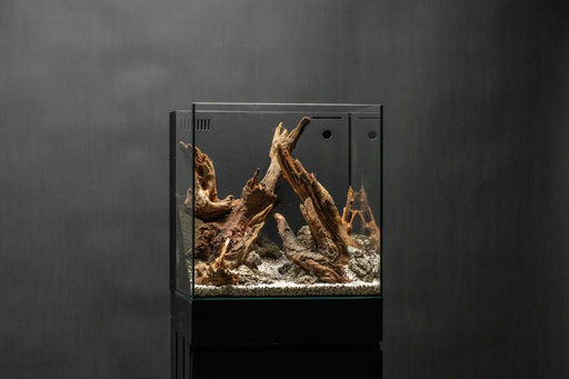 Natural driftwood piece from UNSHARDSCAPE's Pacific Wood collection, featuring weathered, textured wood with organic shapes and natural tones.