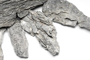 Long Seiryu stone from UNSHARDSCAPE for hardscape projects, showcasing natural gray texture and elongated shape.