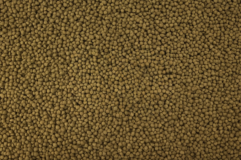 Ultra Fresh Royal Cichlid Premium Pellet food in a clear container, designed for optimal nutrition for cichlids.