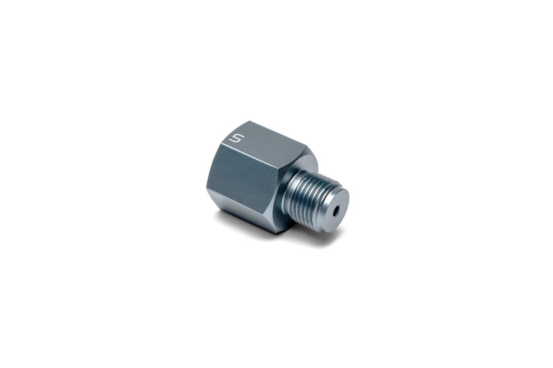 UNS Micro CO2 Paintball Adapter connected to a CO2 tank for easy paintball gun refilling and equipment use.