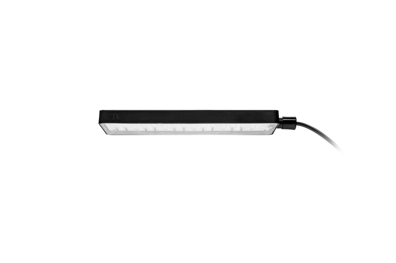 Ultum Nature Systems UNS Mini Refugium Light, magnetized LED lighting for aquarium refugiums, mounted on a glass surface.