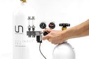 UNS Pro dual-stage CO2 regulator showing pressure gauges and control knobs for precise gas regulation.
