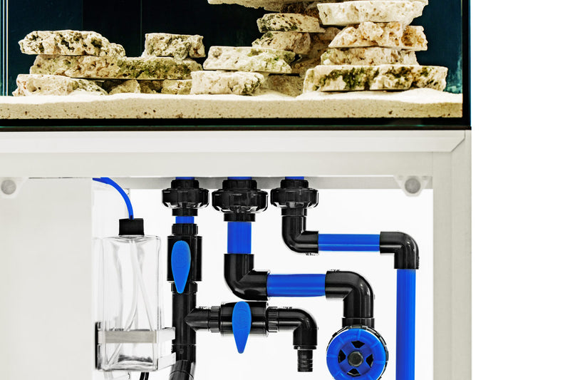 Rimless UNS Reef System R60 aquarium by Ultum Nature Systems, clear glass tank with sleek edges and modern design.