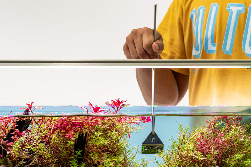 Stainless steel algae scraper from UNSTOOLS, a durable accessory for cleaning algae from aquarium glass surfaces.