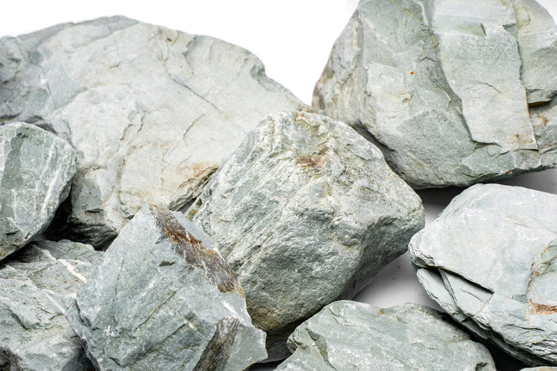 Green Verdant Stone from UNSHARDSCAPE showcasing a smooth, polished natural stone with vibrant green hues and unique texture.