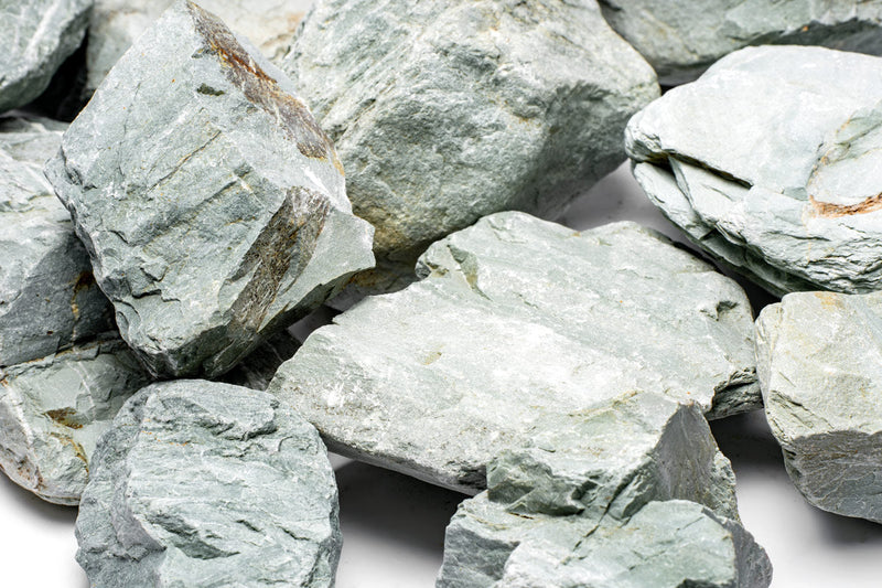Green Verdant Stone from UNSHARDSCAPE, showcasing a textured natural stone ideal for landscaping or decorative use.