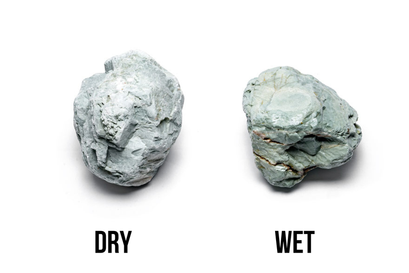 Green Verdant Stone from UNSHARDSCAPE, showcasing a textured natural stone with vibrant green and earthy tones.