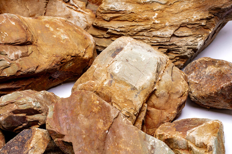 UNSHARDSCAPE Yukon Canyon Stone showing textured natural stone surface with earthy tones for landscaping projects.