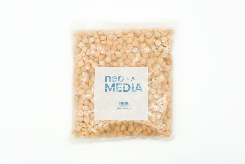 Aquario Neo Media Pure filter cartridge for aquarium filtration system, showing the white filter media inside a transparent casing.