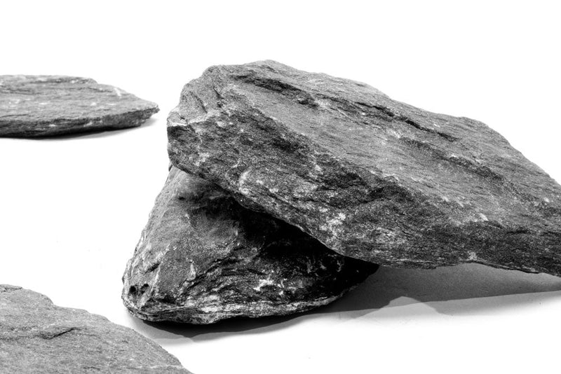 Black slate hardscape tile by UNSHARDSCAPE, showing smooth, dark slate surface suitable for outdoor landscaping projects.