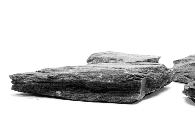Black Slate hardscape from UNSHARDSCAPE showing smooth, matte textured black stone suitable for outdoor landscaping projects.