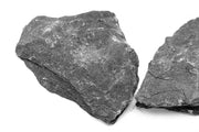 Black slate hardscape from UNSHARDSCAPE, showing textured dark stone surface ideal for outdoor landscaping projects.