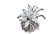 Buce Plant enamel pin from BP Apparel featuring a vibrant, detailed plant design on a metal pin for apparel decoration.