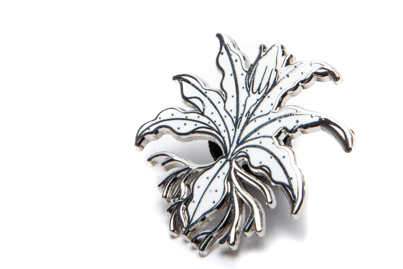 Buce Plant enamel pin from BP Apparel featuring a vibrant, detailed plant design on a metal pin for apparel decoration.
