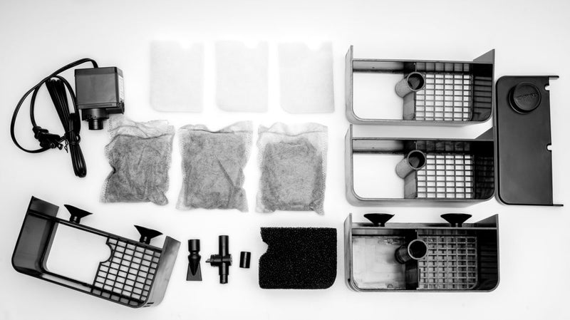 Dymax eZ Filter for water purification, showcasing the compact filter unit with clear plastic housing and filter media inside.