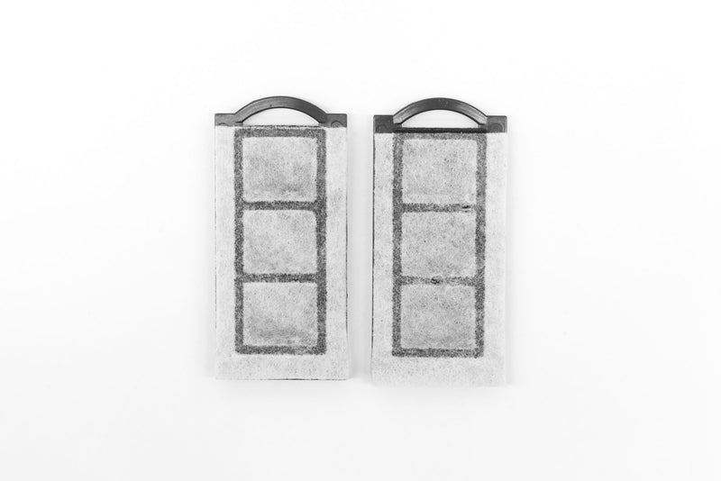 Dymax Slim Flo filter cartridge for accessories, compact water filtration component with a white exterior and threading for installation.