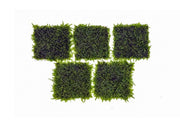 Mini Christmas moss on stainless steel display, showcasing lush green moss tied to a sleek metal surface for decorative use.