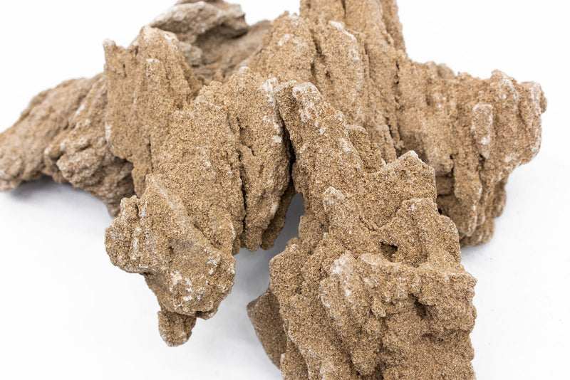Natural stone from UNSHARDSCAPE resembling mountain terrain, with rugged texture and earthy tones, suitable for landscaping or decorative use.