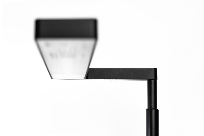 ONF Flat Nano Stand LED Light illuminating a workspace with sleek, portable lighting design.