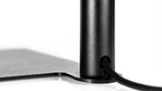 ONF Flat Nano Stand LED Light on a desk, compact lighting device with adjustable stand for photography or video use.