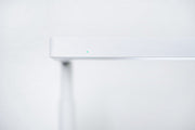 White ONF Flat Nano+ Stand LED light with adjustable arm and compact design, ideal for photography and studio lighting.