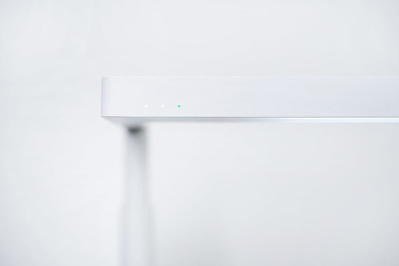 White ONF Flat Nano+ Stand LED light with adjustable arm and compact design, ideal for photography and studio lighting.